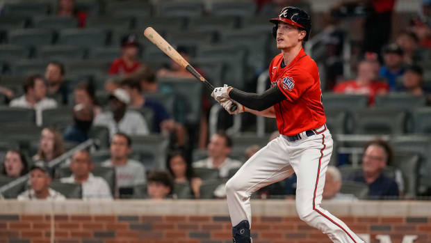 Aug 6, 2021; Cumberland, Georgia, USA; Atlanta Braves starting pitcher Max Fried (54) hits a pinch-hit double against the Washington Nationals during the sixth inning at Truist Park.