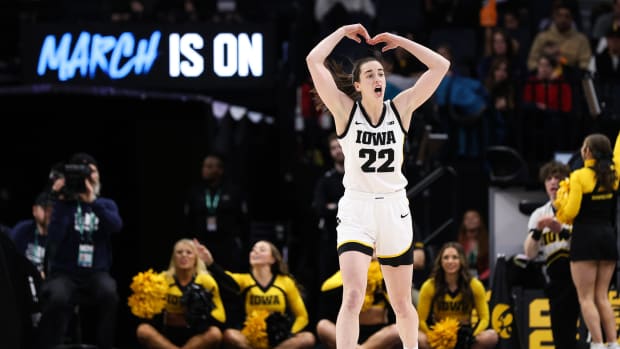 Mar 4, 2023; Minneapolis, MINN, USA; Iowa Hawkeyes guard Caitlin Clark (22) reacts to the crowd during the first half against the Maryland Terrapins at Target Center.