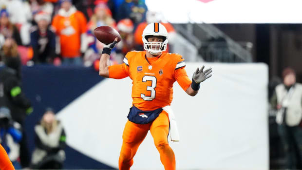 Dec 24, 2023; Denver, Colorado, USA; Denver Broncos quarterback Russell Wilson (3) prepares to pass in the first half against the New England Patriots at Empower Field at Mile High.