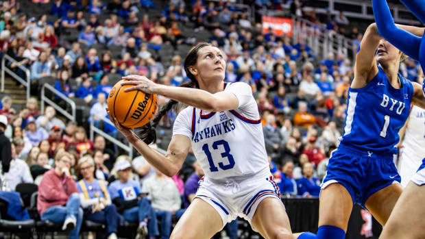 Kansas Jayhawk guard Holly Kersgieter prepares to shoot against Amari Whiting of the BYU Cougars in the Big 12 Women's Championship in the T-Mobile Center in Kansas City, MO.