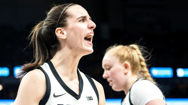 Iowa guard Caitlin Clark (22) reacts after drawing a foul during the Big Ten Women's Basketball tournament quarterfinals at the Target Center on Friday, March 8, 2024, in Minneapolis, Minn.