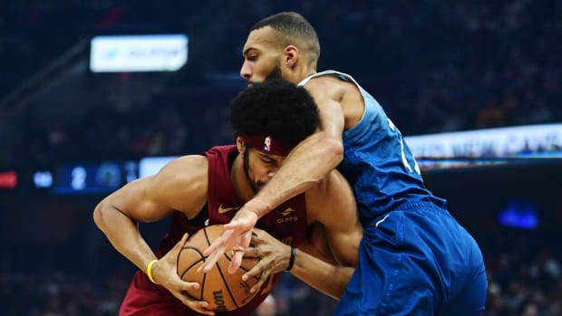 Mar 8, 2024; Cleveland, Ohio, USA; Cleveland Cavaliers center Jarrett Allen (31) drives to the basket against Minnesota Timberwolves center Rudy Gobert (27) during the first half at Rocket Mortgage FieldHouse.