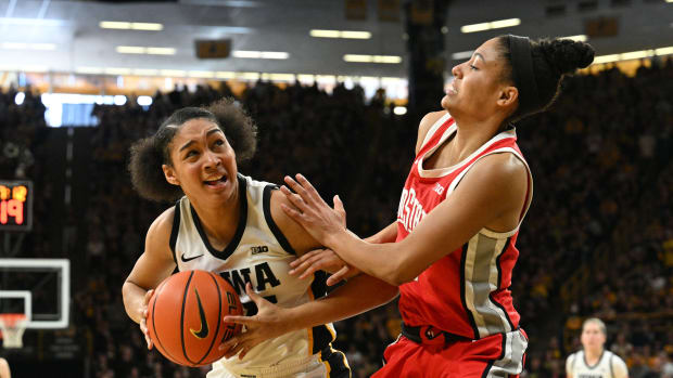 Iowa Hawkeyes forward Hannah Stuelke (45) goes to the basket as Ohio State Buckeyes guard Taylor Thierry (2) defends during the fourth quarter at Carver-Hawkeye Arena.