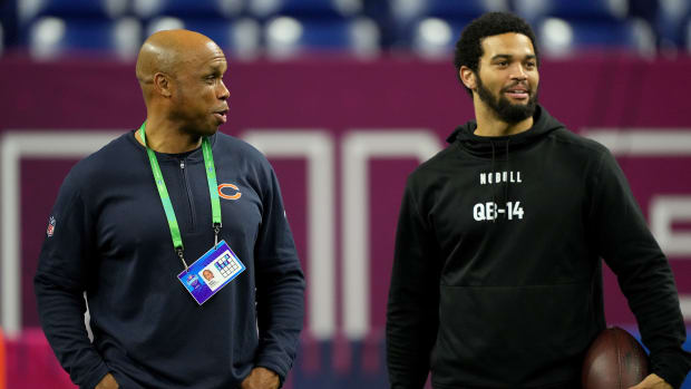 Caleb Williams talks with Bears QB coach Kerry Joseph on the sidelines at the combine.