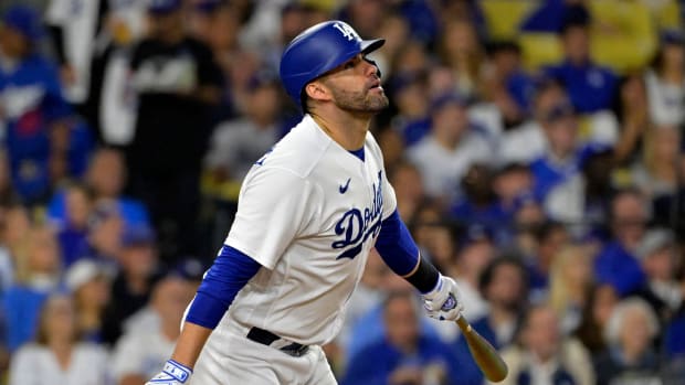 Oct 9, 2023; Los Angeles, California, USA; Los Angeles Dodgers designated hitter J.D. Martinez (28) hits a home run against the Arizona Diamondbacks during the fourth inning for game two of the NLDS for the 2023 MLB playoffs at Dodger Stadium.