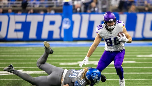Jan 7, 2024; Detroit, Michigan, USA; Detroit Lions linebacker Alex Anzalone (34) dives and tackles Minnesota Vikings tight end Johnny Mundt (86) during second half at Ford Field.