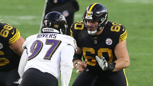 Dec 2, 2020; Pittsburgh, Pennsylvania, USA; Pittsburgh Steelers center J.C. Hassenauer (60) blocks at the line of scrimmage against Baltimore Ravens linebacker Chauncey Rivers (97) during the second quarter at Heinz Field. The Steelers won 19-14. Mandatory Credit: Charles LeClaire-USA TODAY Sports