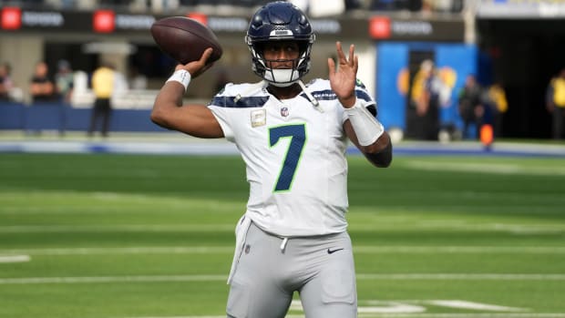 Seahawks quarterback Geno Smith throws a pass in warmups before a game.