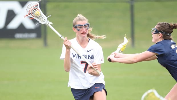 Mackenzie Hoeg looks to pass during the Virginia women's lacrosse game against Notre Dame at Klockner Stadium.
