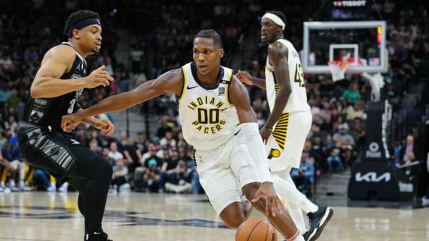 Mar 3, 2024; San Antonio, Texas, USA; Indiana Pacers guard Bennedict Mathurin (00) dribbles past San Antonio Spurs forward Keldon Johnson (3) in the first half at Frost Bank Center.
