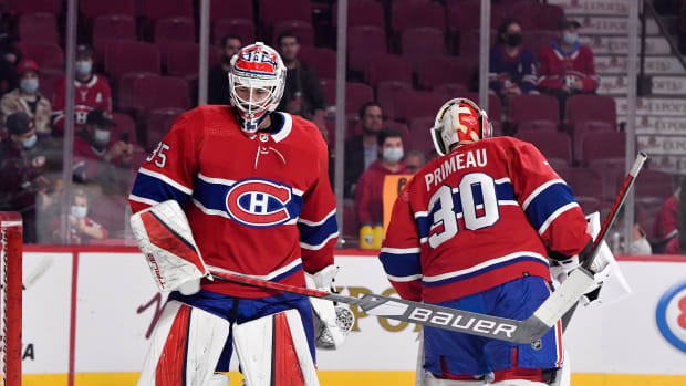 Nov 18, 2021; Montreal, Quebec, CAN; Montreal Canadiens goalie Sam Montembeault (35) and teammate goalie Cayden Primeau (30) switch places in net during the warmup period before the game against the Pittsburgh Penguins at the Bell Centre. Mandatory Credit: Eric Bolte-USA TODAY Sports
