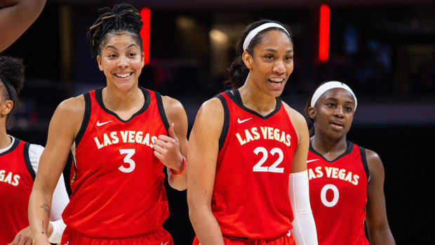 Candace Parker and A’ja Wilson celebrate a win.
