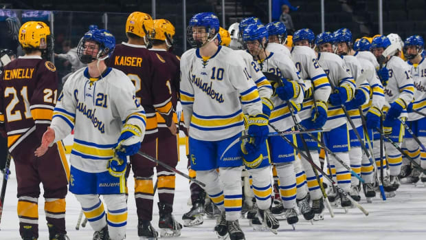 St. Cloud Cathedral boys hockey team shakes hands with Northfield on March 6 after the 2024 Class 1A state tournament opening round at the Xcel Energy Center in St. Paul. Cathedral won 5-1.
