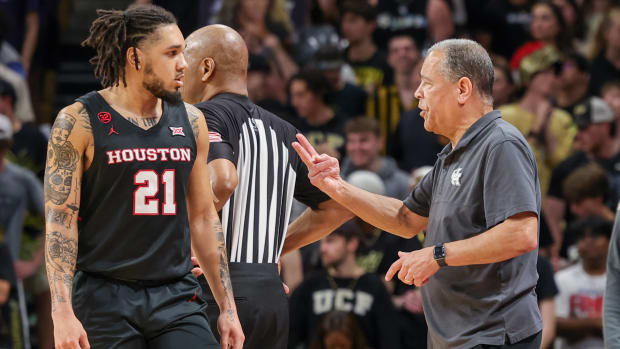Mar 6, 2024; Orlando, Florida, USA; Houston Cougars head coach Kelvin Sampson talks with guard Emanuel Sharp (21) during the second half against the UCF Knights at Addition Financial Arena. Mandatory Credit: Mike Watters-USA TODAY Sports  