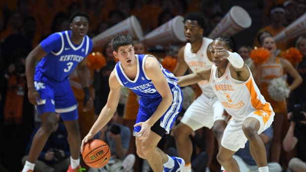 Kentucky guard Reed Sheppard (15) dribbles the ball while defended by Tennessee guard Jordan Gainey (2) during an NCAA college basketball game between Tennessee and Kentucky in Knoxville, Tenn., Saturday, March 9, 2024.