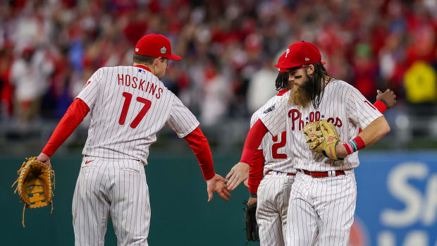 Nov 1, 2022; Philadelphia, PA, USA; Philadelphia Phillies center fielder Brandon Marsh (16) and first baseman Rhys Hoskins (17) celebrate after the Phillies defeated the Houston Astros in game three of the 2022 World Series at Citizens Bank Park. Mandatory Credit: Bill Streicher-USA TODAY Sports