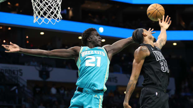 Brooklyn Nets center Nic Claxton (33) gets blocked by Charlotte Hornets forward JT Thor (21) during the third quarter at Spectrum Center. 