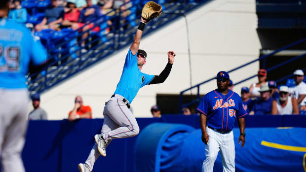 Mar 26, 2023; Port St. Lucie, Florida, USA; Miami Marlins first baseman Troy Johnston (46) attempts to make a catch against the New York Mets during the second inning at Clover Park.