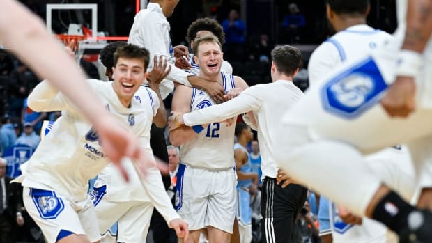 Drake Bulldogs guard Tucker DeVries (12) celebrates with teammates after Drake defeated the Indiana State Sycamores to win the Missouri Valley Conference Tournament Championship at Enterprise Center in St. Louis on March 10, 2024.