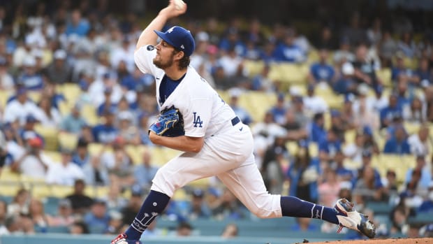 Jun 28, 2021; Los Angeles, California, USA; Los Angeles Dodgers starting pitcher Trevor Bauer (27) pitches against the San Francisco Giants in the first inning at Dodger Stadium.