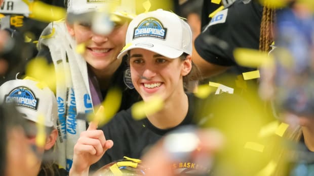 Iowa guard Caitlin Clark celebrates winning the 2024 Big Ten title.