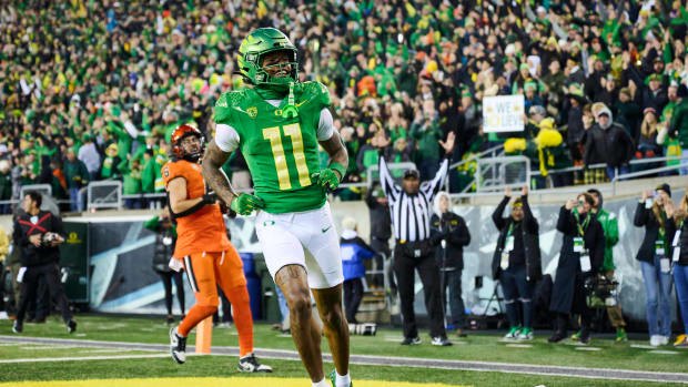 Nov 24, 2023; Eugene, Oregon, USA; Oregon Ducks wide receiver Troy Franklin (11) celebrates after catching a pass for a touchdown during the first half against the Oregon State Beavers at Autzen Stadium. Mandatory Credit: Troy Wayrynen-USA TODAY Sports  