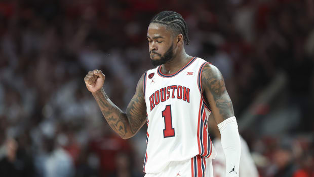 Mar 9, 2024; Houston, Texas, USA; Houston Cougars guard Jamal Shead (1) reacts after a play during the first half against the Kansas Jayhawks at Fertitta Center. 