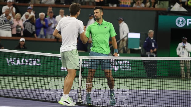 Novak Djokovic shakes hands with Luca Nardi after defeat at Indian Wells.