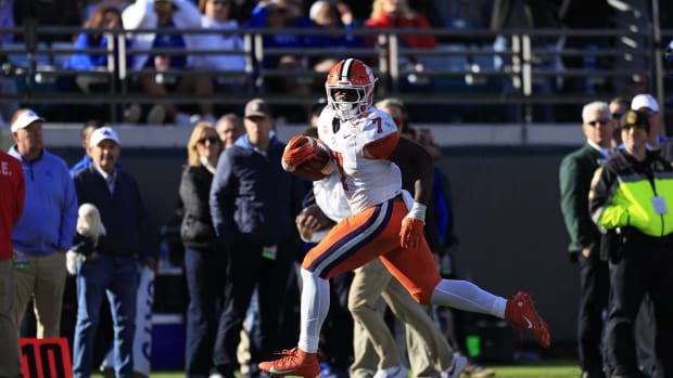 Clemson Tigers running back Phil Mafah (7) scores a touchdown during the fourth quarter of an NCAA football matchup in the TaxSlayer Gator Bowl Friday, Dec. 29, 2023 at EverBank Stadium in Jacksonville, Fla. The Clemson Tigers edged the Kentucky Wildcats 38-35.