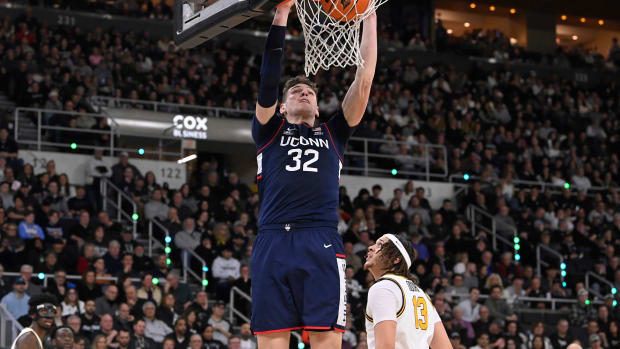 Mar 9, 2024; Providence, Rhode Island, USA; Connecticut Huskies center Donovan Clingan (32) dunks the ball against the Providence Friars during the second half at Amica Mutual Pavilion. Mandatory Credit: Eric Canha-USA TODAY Sports