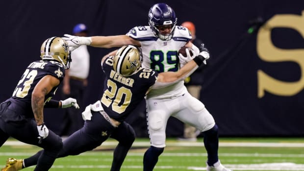 Will Dissly catches one against the Saints and makes it hard to bring him down.
