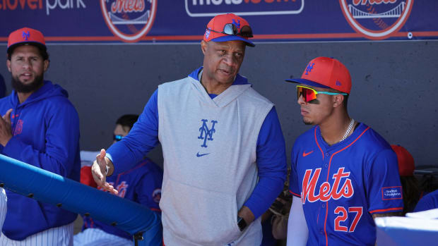 Feb 27, 2024; Port St. Lucie, Florida, USA; New York Mets great Darryl Strawberry talks with New York Mets third baseman Mark Vientos (27) before the game against the Miami Marlins at Clover Park.