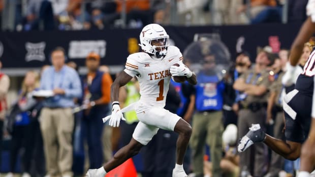 Dec 2, 2023; Arlington, TX, USA; Texas Longhorns wide receiver Xavier Worthy (1) runs with the ball against the Oklahoma State Cowboys during the fourth quarter at AT&T Stadium. Mandatory Credit: Andrew Dieb-USA TODAY Sports  