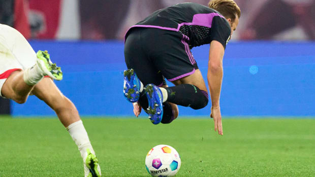 Harry Kane pictured falling over following a challenge with Xaver Schlager during Bayern Munich's 2-2 draw with RB Leipzig in September 2023
