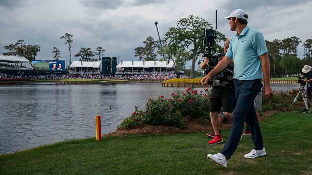 Scottie Scheffler walks to the 17th hole during the final round of the 2023 Players Championship at the Stadium Course at TPC Sawgrass in Ponte Vedra Beach, Fla.