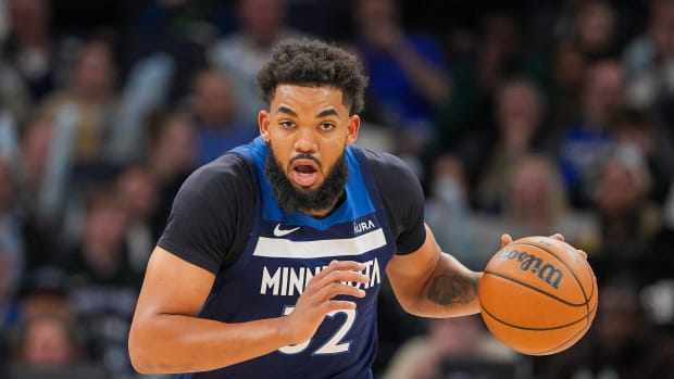 Mar 4, 2024; Minneapolis, Minnesota, USA; Minnesota Timberwolves center Karl-Anthony Towns (32) dribbles against the Portland Trail Blazers in the third quarter at Target Center.