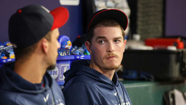 Sep 29, 2023; Atlanta, Georgia, USA; Atlanta Braves starting pitcher Max Fried (54) talks to starting pitcher Charlie Morton (50) in the dugout against the Washington Nationals in the third inning at Truist Park. Mandatory Credit: Brett Davis-USA TODAY Sports