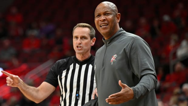 Louisville Cardinals head coach Kenny Payne reacts to a call during the first half of a game against the Virginia Tech Hokies.
