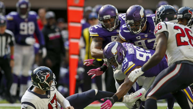 Oct 9, 2016; Minneapolis, MN, USA; Minnesota Vikings defensive tackle Tom Johnson (92) and defensive end Everson Griffen (97) and defensive end Danielle Hunter (99) force Houston Texans quarterback Brock Osweiler (17) to the ground for a loss in the fourth quarter at U.S. Bank Stadium. The Vikings win 31-13.