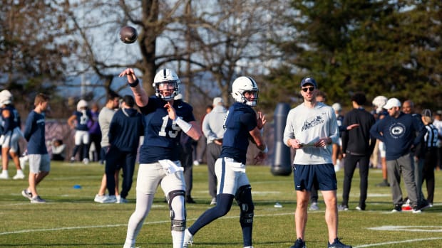 Penn State quarterbacks Drew Allar (15) and Beau Pribula throw during the first day of spring football practice in State College.