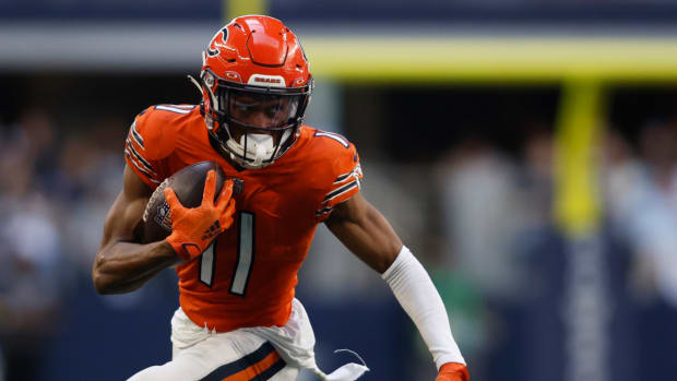 Oct 30, 2022; Arlington, Texas, USA; Chicago Bears wide receiver Darnell Mooney (11) runs for a first down in the third quarter against the Dallas Cowboys at AT&T Stadium.  