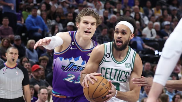 Mar 18, 2023; Salt Lake City, Utah, USA; Boston Celtics guard Derrick White (9) drives on Utah Jazz forward Lauri Markkanen (23) in the first quarter at Vivint Arena. Mandatory Credit: Rob Gray-USA TODAY Sports