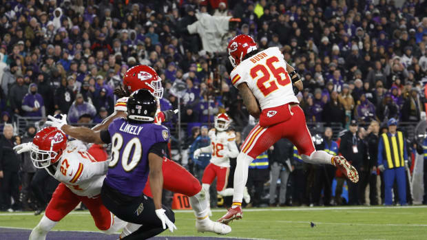 Jan 28, 2024; Baltimore, Maryland, USA; Kansas City Chiefs safety Deon Bush (26) intercepts a pass in the end zone intended for Baltimore Ravens tight end Isaiah Likely (80) during the second half in the AFC Championship football game at M&T Bank Stadium. Mandatory Credit: Geoff Burke-USA TODAY Sports  