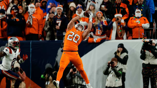 Denver Broncos fullback Michael Burton (20) makes a catch in the first quarter against the New England Patriots at Empower Field at Mile High.