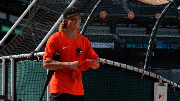 Jul 27, 2022; Baltimore, Maryland, USA; Baltimore Orioles number one draft pick Jackson Holliday walks on the field during the batting practice before the game against the Tampa Bay Rays at Oriole Park at Camden Yards. Holliday was the number one over draft pick in the 2022 MLB Draft. Mandatory Credit: Tommy Gilligan-USA TODAY Sports