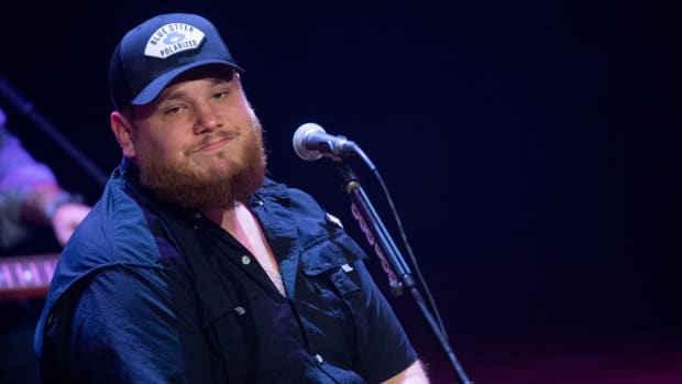 Luke Combs performs during the \"Living Lucky With Luke Combs\" performance at the Ryman Auditorium in Nashville, Tenn., Tuesday, Feb. 6, 2024. The performance was part of a multi-state lottery experience which was created via collaboration between ECE, Atlas Experiences, and Luke Combs.  