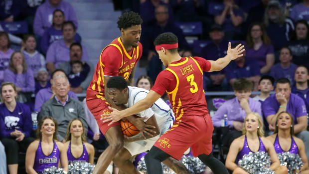 Mar 9, 2024; Manhattan, Kansas, USA; Kansas State Wildcats guard Cam Carter (5) is guarded by Iowa State Cyclones guard Tamin Lipsey (3) and forward Hason Ward (24) during the second half at Bramlage Coliseum. Mandatory Credit: Scott Sewell-USA TODAY Sports  