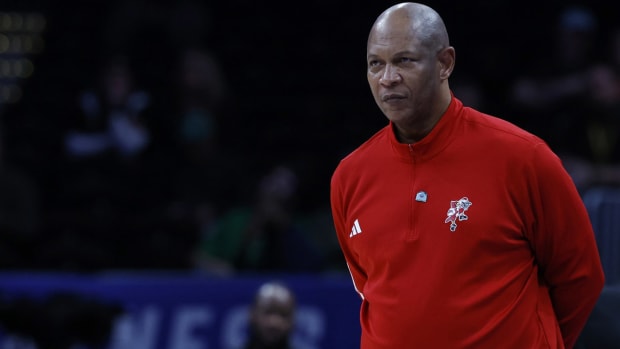 Kenny Payne coaches Louisville on the sidelines.