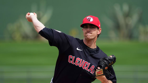 Mar 12, 2024; Surprise, Arizona, USA; Cleveland Guardians starting pitcher Shane Bieber (57) pitches against the Texas Rangers during the first inning at Surprise Stadium.
