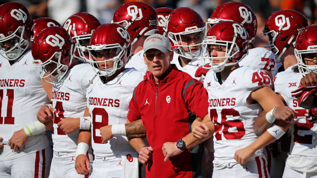 Oklahoma coach Brent Venables locks arms with his team, including Dillon Gabriel (8) and place kicker Gavin Marshall (46) before the Red River Rivalry college football game between the University of Oklahoma Sooners (OU) and the University of Texas (UT) Longhorns at the Cotton Bowl in Dallas, Saturday, Oct. 7, 2023. Oklahoma won 34-30.